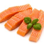 fresh-salmon-fillet-with-basil-white-background_120872-25364